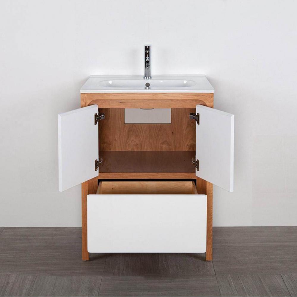 Free standing under counter vanity with routed finger pulls on two doors and one drawer. Bathroom