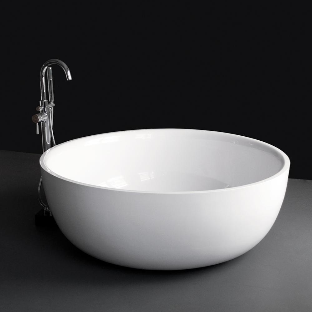 Free-standing soaking bathtub made of white solid surface with a decorative solid surface drain